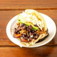 Pabellõn · Shredded beef, black beans, sweet, plantains, avocado and white cheese.