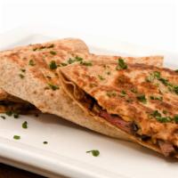 Steak Quesadilla · Juicy marinated steak with cheese, onions, peppers with a side of salsa and sour cream.