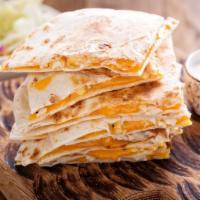 Cheese Quesadilla · Flour tortilla grilled and stuffed with Oaxaca cheese, served with guacamole and sour cream.