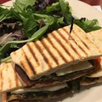 Grilled Eggplant · With fresh mozzarella, roasted red peppers and arugula, served with light tomato dipping sau...