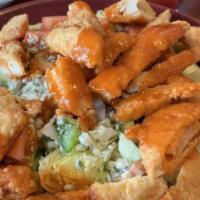 Buffalo Chicken Bleu Cheese Salad · Breaded and lightly fried chicken tenderloins, tossed in a spicy buffalo sauce over a bed of...
