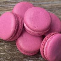 Raspberry Macaron · Raspberry Swiss buttercream & raspberry preserve layered between two raspberry macaron shells.