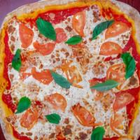 Grandma Deep Pan Pizza · Fresh mozzarella cheese, tomatoes, and garlic.