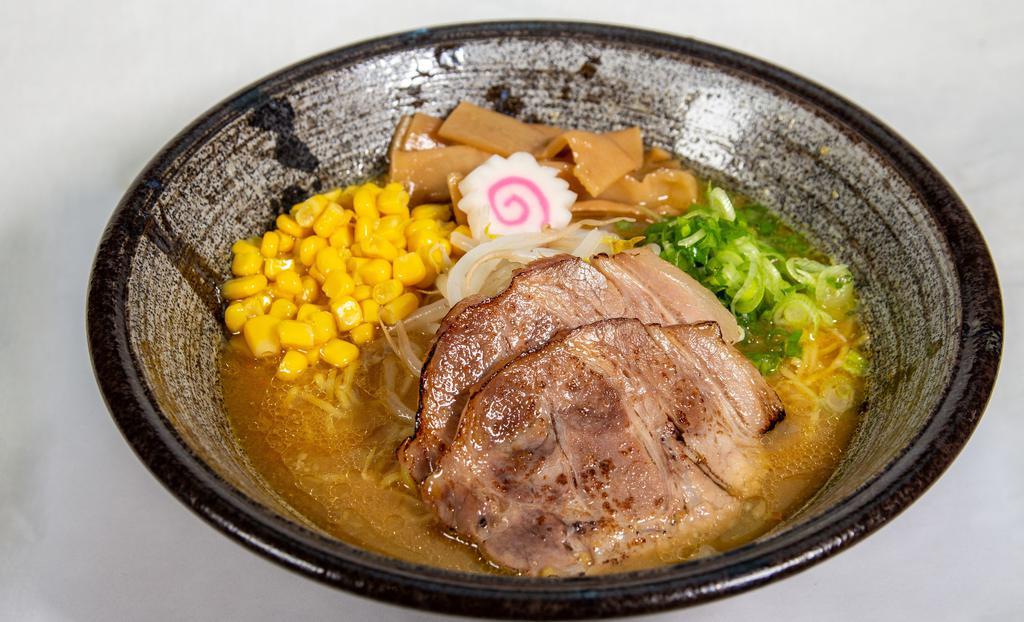 Chicken Miso · Chicken broth with homemade miso flavouring, topped with two slices of pork, scallions, menma bamboo shoots, naruto fish cake, corn, and bean sprouts