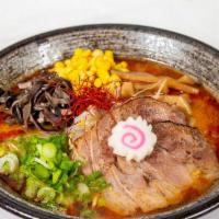 Tori Tonkotsu Spicy Miso · Pork AND chicken broth mixed together with homemade miso and spicy flavouring, topped with t...