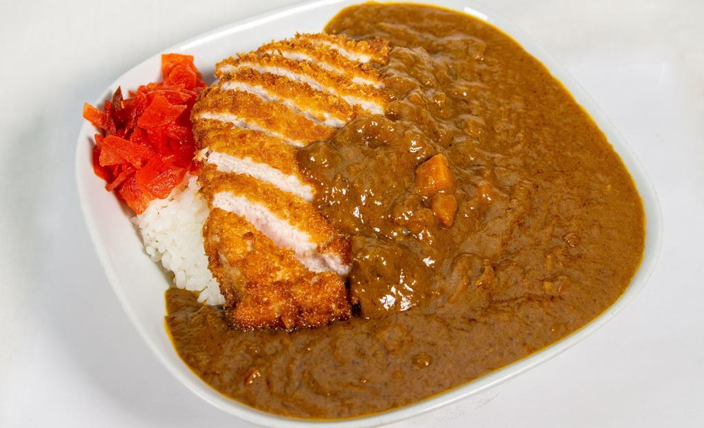 Katsu Curry · Special house curry sauce and pork cutlet served on white rice.