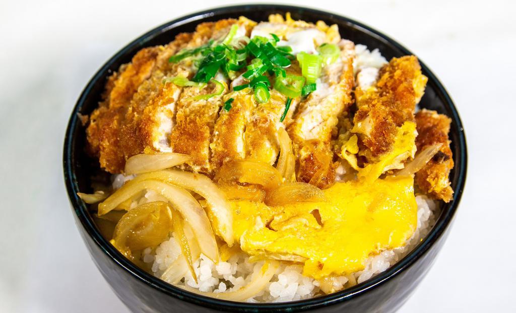 Chicken Katsu Don · Layer of chicken cutlet, egg, and onions over a bowl of white rice