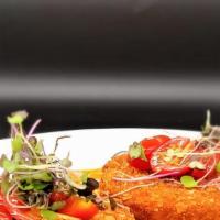 Maryland Crab Cake · Lump and Jumbo Crab Meat mixed with bread crumbs, served roasted peppers sauce