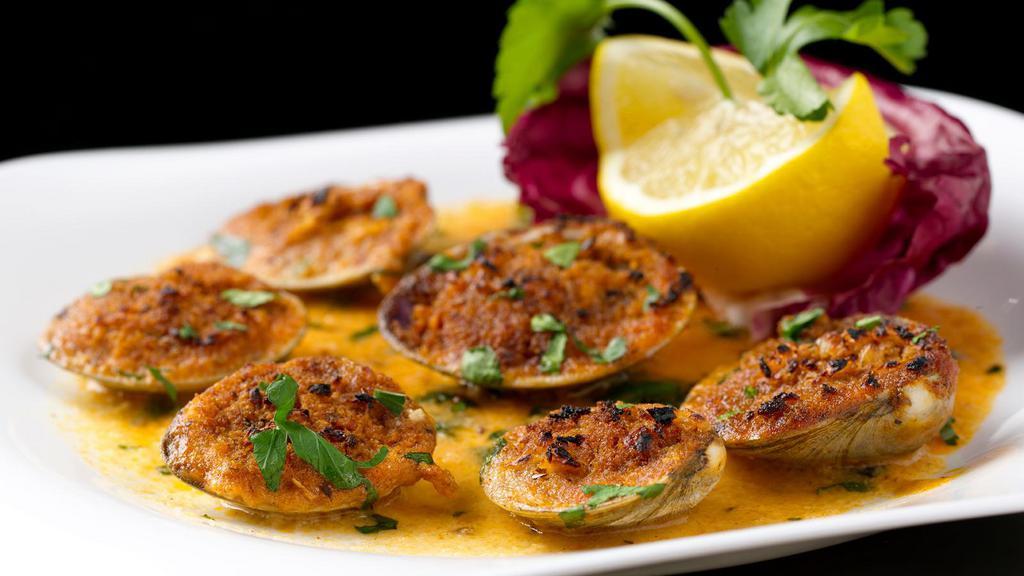 6 Baked Clams · Cooked in a white wine lemon sauce and covered with breadcrumbs.