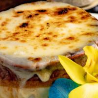 French Onion Soup · A beef stock soup with caramelized onions and a slice of garlic bread inside with mozzarella...