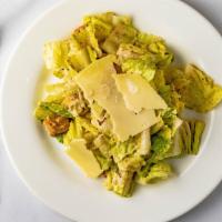 Caesar Salad · Romaine lettuce cut in inch and baked croutons tossed with grated Parmesan cheese and homema...