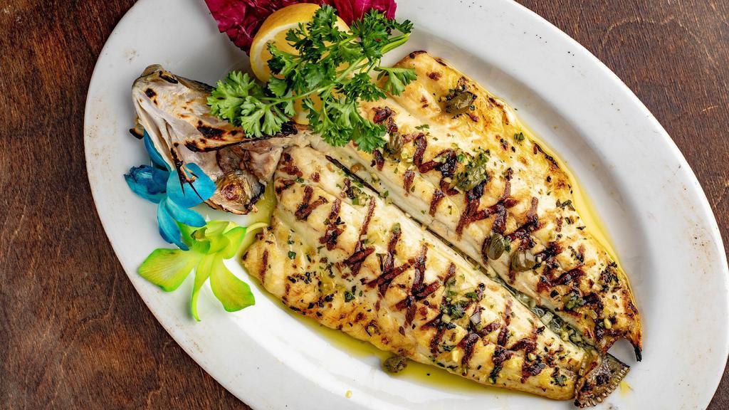 Grilled Branzino · Whole Mediterranean bass served with garlic, parsley, capers and olive oil.