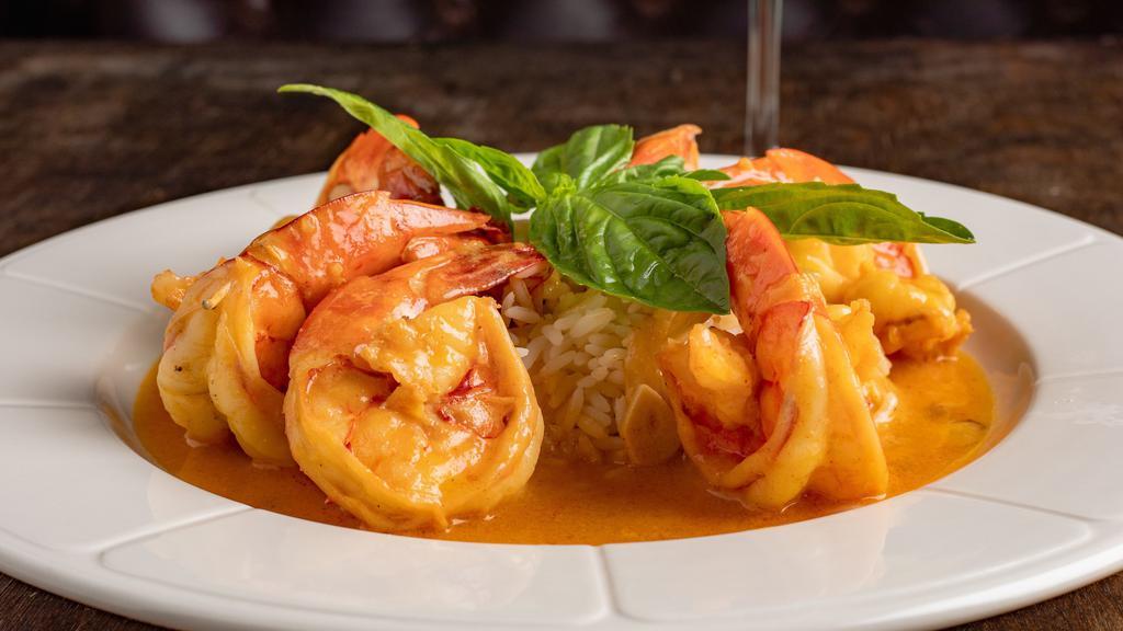 Shrimp Scampi · Sautéed with garlic and white wine lemon sauce and over rice.
