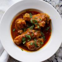 Chicken Curry · Boneless chicken cubes cooked in sauce with onion, tomatoes, garlic, ginger, hint of chilies...