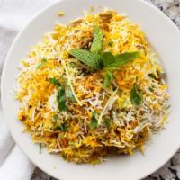 Chicken Biryani · Chicken on a bone, marinated and cooked with rice, mint and special spices.