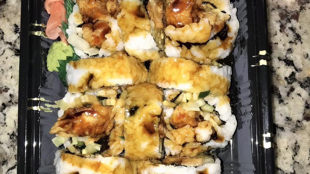Chicken Tempura Roll · Fried chichen with avocado and cucumber and eel sauce on the top.