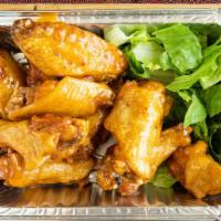 12 Pieces Chicken Wings
 · Cooked wing of a chicken coated in sauce or seasoning.