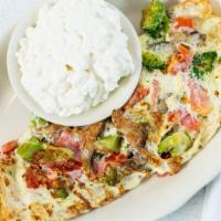 Doctor'S Choice · Egg white omelette with mushrooms, tomatoes, and broccoli, served with scoop of cottage chee...