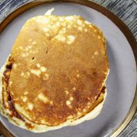 Pancakes · Vegetarian, vegan. Choice of buttermilk or whole wheat. Served with butter and syrup.
