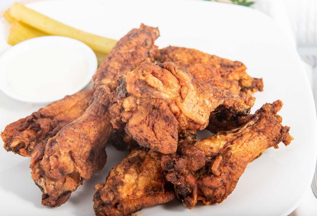 Chicken Wings · Juicy and delicious wings made with the blend of seasonings and fried to perfection or with your choice of dry rub, barbecue, teriyaki, or buffalo sauce. Served with fries or onion rings and salad or coleslaw.