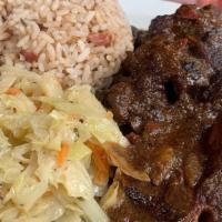 Oxtail · Seasoned with Caribbean herbs and spices, braised to perfection in a sauce with butter beans...