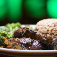 Jerk Chicken · Chicken marinated in spicy jerk seasoning and slow-roasted to perfection.
