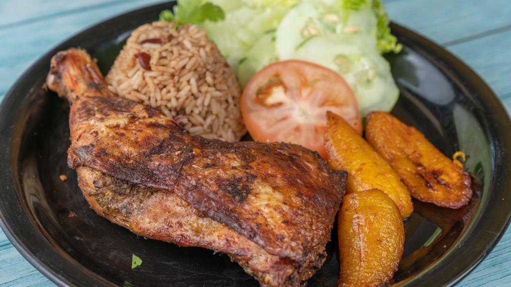 Jerk Chicken · Served with rice and peas or white rice-cabbage.
