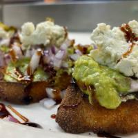 Avocado Bruschetta · Grilled tuscan bread topped with avocado, red onion, roasted chili peppers, gorgonzola and b...