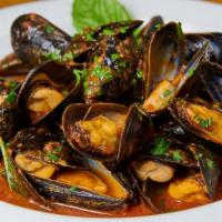 Mussels Fra Diavolo · P.E.I. mussels sauteed with tomatoes, chili, garlic, and white wine.