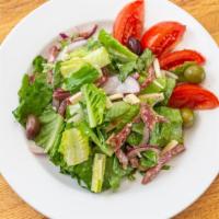 Siciliana Salad · Romaine lettuce with salami, provolone, tomato, olives, and red onions.