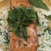 Broiled Salmon · Served over a bed of rice and a vegetable side.