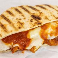 Chicken Parmigiana · Breaded chicken mozzarella, marinara sauce, and melted parmesan cheese.