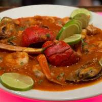 Mariscada · Shrimp, crab legs, lobster and crab meat in red sauce.