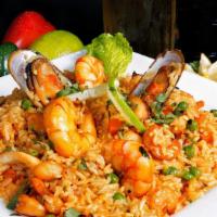 Arroz Conmariscos/Seafood Rice · Rice mixed with seafood and vegetables.