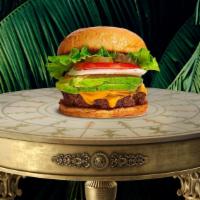 Secret Avocado Burger · Seasoned plant-based patty topped with avocado, melted vegan cheese, lettuce, tomato, onion,...