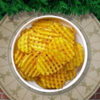 Waffle Shuffle Fries · Idaho potatoes sliced in an alternating waffle pattern, fried until golden brown, and garnis...