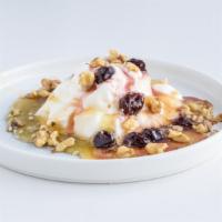 Yogurts With Cherries & Honey · Authentic Greek Yogurt coated with sour cherry preserve, drizzled with fresh honey and toppe...