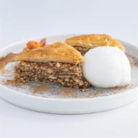 Baklava · Almonds, walnuts, cinnamon, layers of phyllo baked with honey syrup.
