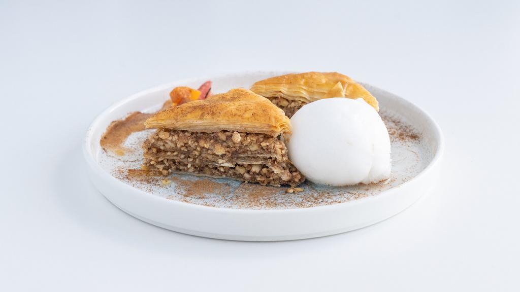 Baklava · Almonds, walnuts, cinnamon, layers of phyllo baked with honey syrup.