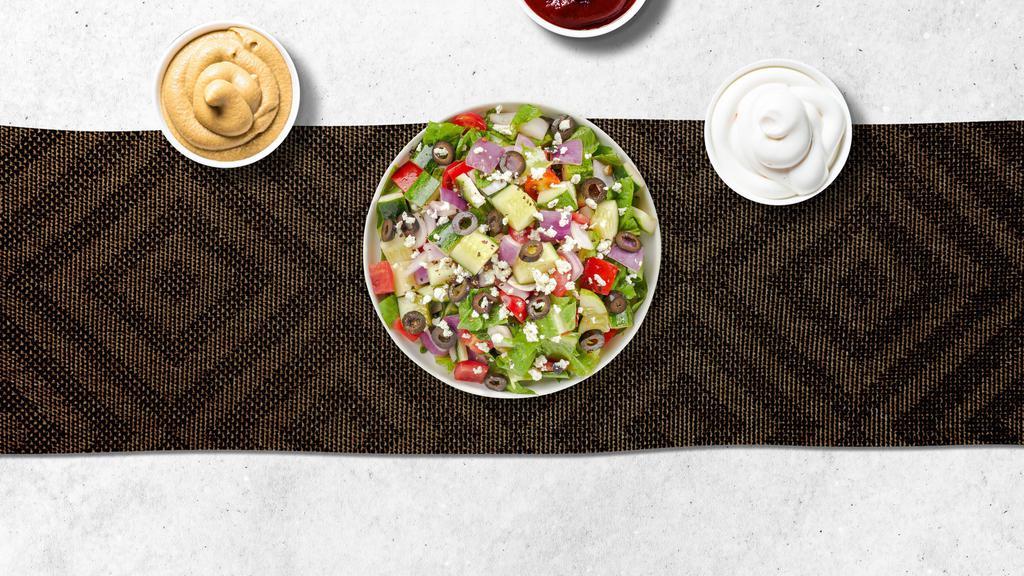 Greek Salad · Mixed greens, tomatoes, cucumbers, radicchio, onions, black olives, and feta cheese  tossed with a creamy feta cheese dressing.