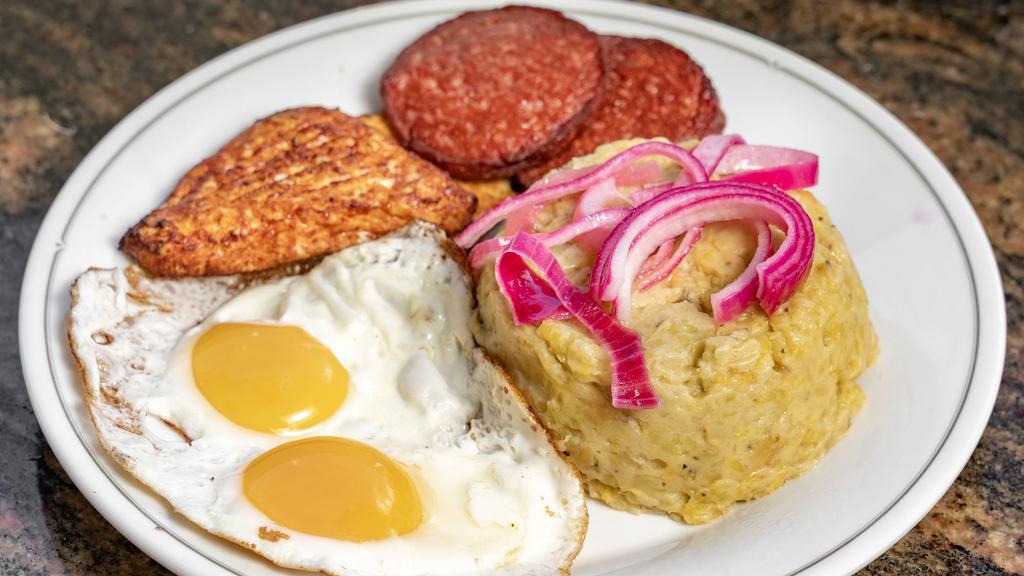 Mangu · Mashed green plantains with butter covered in red onions, comes with choice of fried cheese, salami, and eggs.