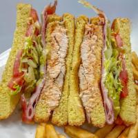 Dominican Club Sandwich · Choice of chicken or pork with ham. Swiss cheese, lettuce and tomato on Texas toast bread wi...