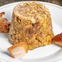 Chicharron Mofongo · Fried pork and deep-fried green plantains mashed together.