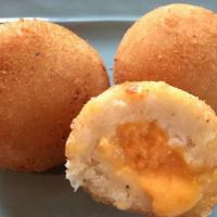 Bola De Yuca Rellena · Fried yuca balls filled with cheese.