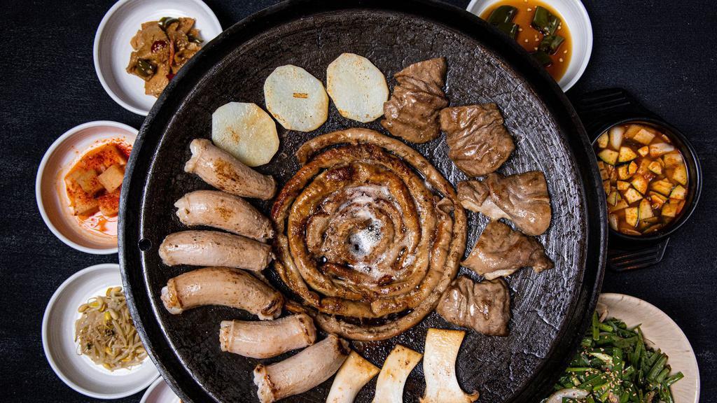 Grilled Small Intestine, Large Intestine, Tripe + Korean Soybean Stew - 2 Servings (대막곱 구이+된장찌개 2인) · Small and large intestines, tripe, potato slices, and mushrooms grilled on a large cast iron pan. Served with sauces and Korean Soybean Stew.