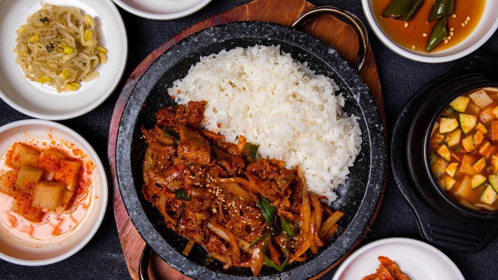 Spicy Marinated Pork (돌판제육덮밥) · Spicy marinated Berkshire pork shoulder stir-fried over rice on a sizzling pan.

* Includes rice and various side dishes.
