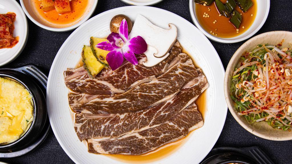 Marinated Beef Short Rib - 2 Servings (La갈비 2인분) · Served with Korean soybean stew. * All meats are fully cooked on a special Korean cast iron pan. * Includes 2 servings of rice and various side dishes.