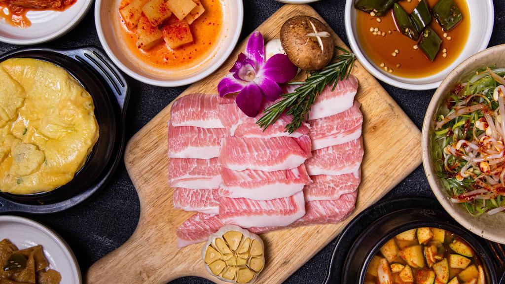 Pork Jowl - 2 Servings (항정살 2인분) · Served with Korean soybean stew. * All meats are fully cooked on a special Korean cast iron pan. * Includes 2 servings of rice and various side dishes.
