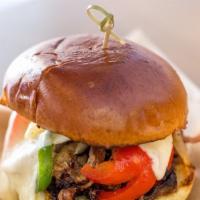 Texas Style Beef Brisket Sandwich · Spicy. Texas-braised spice-rubbed beef brisket over 12 hours, caramelized onions, green bell...
