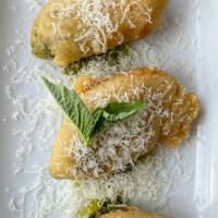 Zucchini Flowers · Fried zucchini flowers stuffed with mozzarella and served with homemade pesto and grated par...